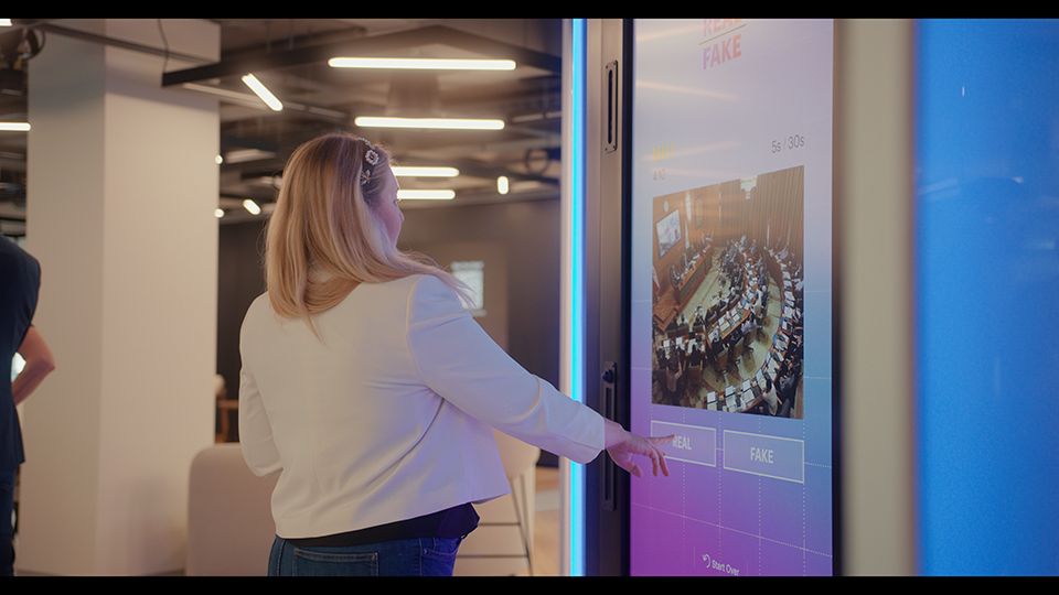 woman-interacting-with-touch-screen